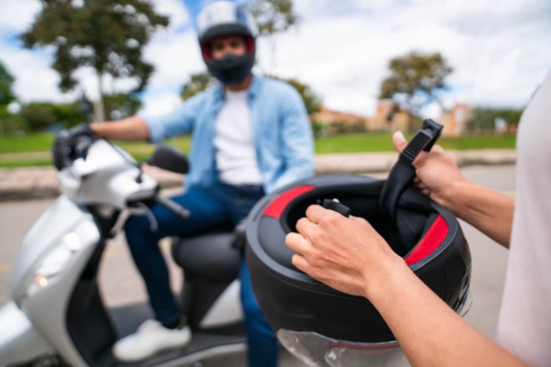A person on a scooter with a helmet

AI-generated content may be incorrect.